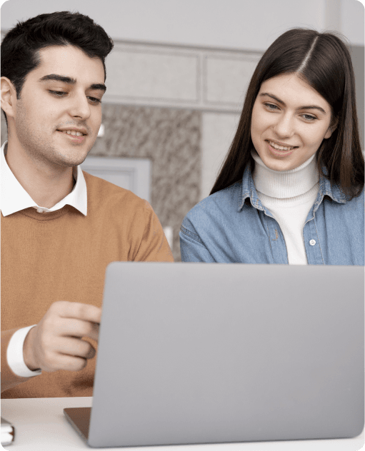 Students looking at laptop